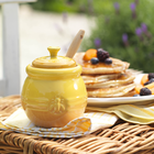 Pot &agrave; miel avec b&acirc;ton